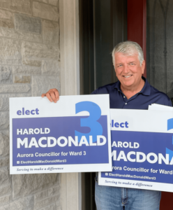Harold with Lawn Signs